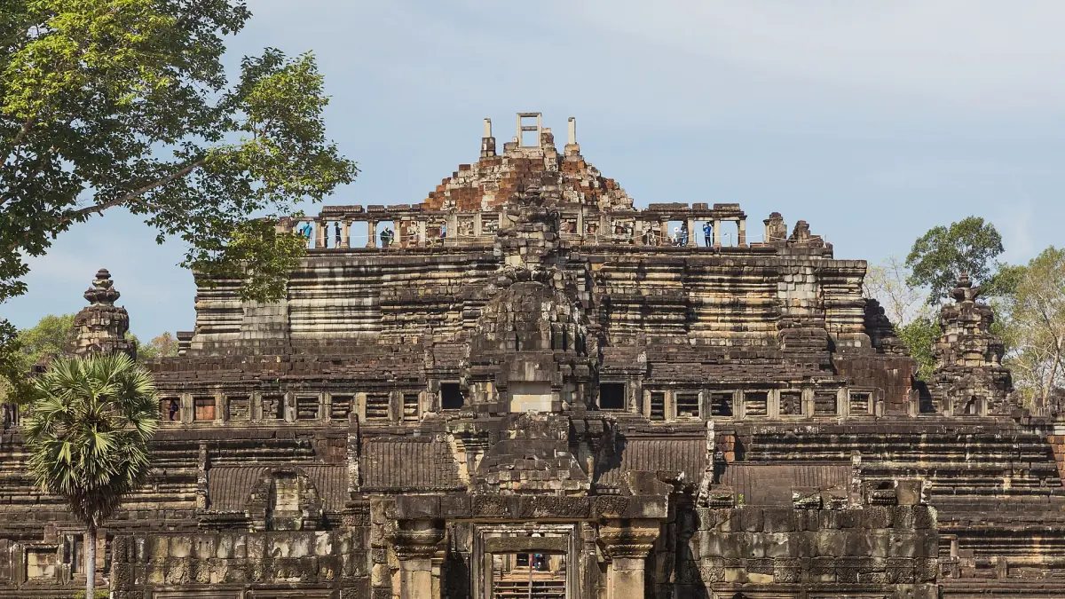 Front of the Baphuon rising in tiers behind trees