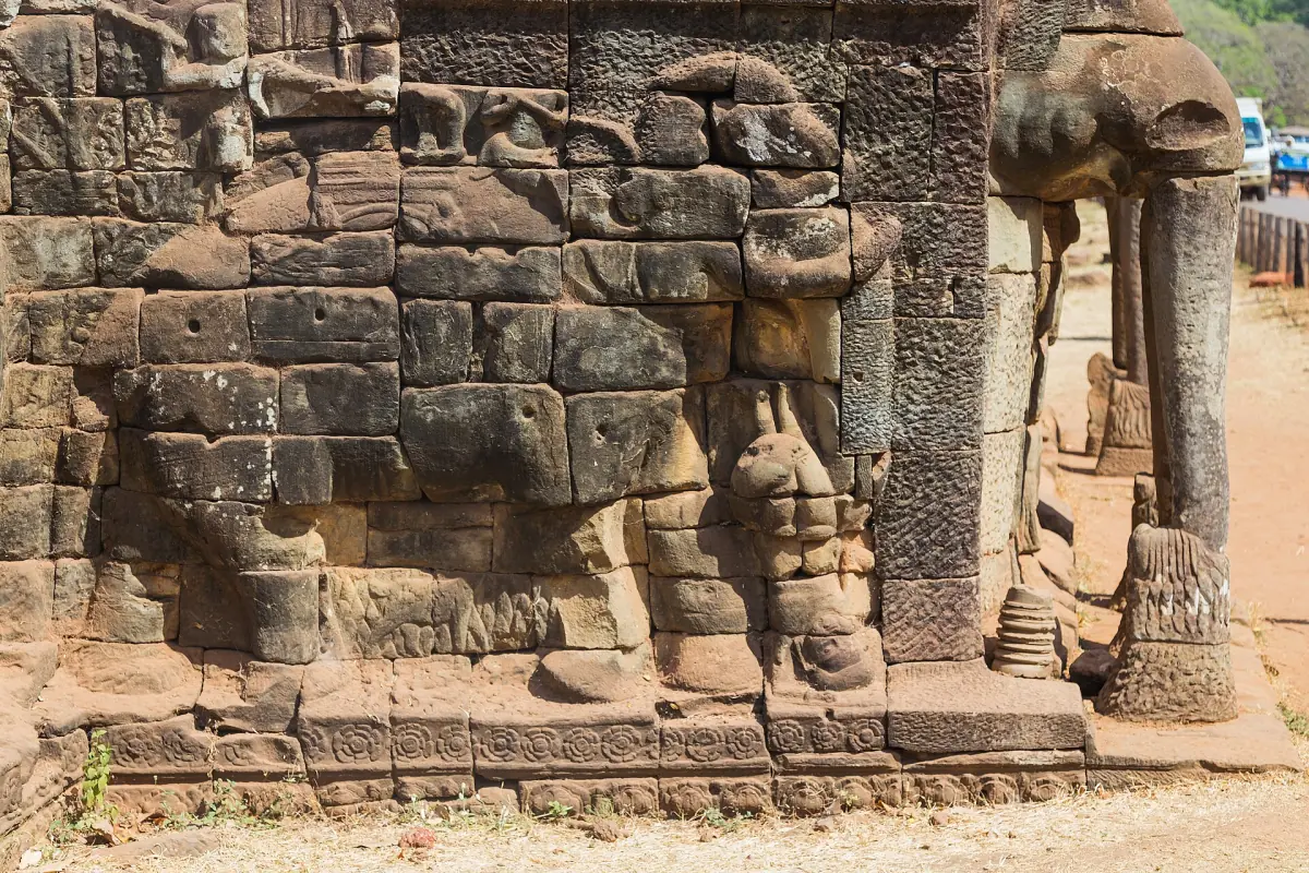 Carved elephant with a trunk reaching down on the terrace wall