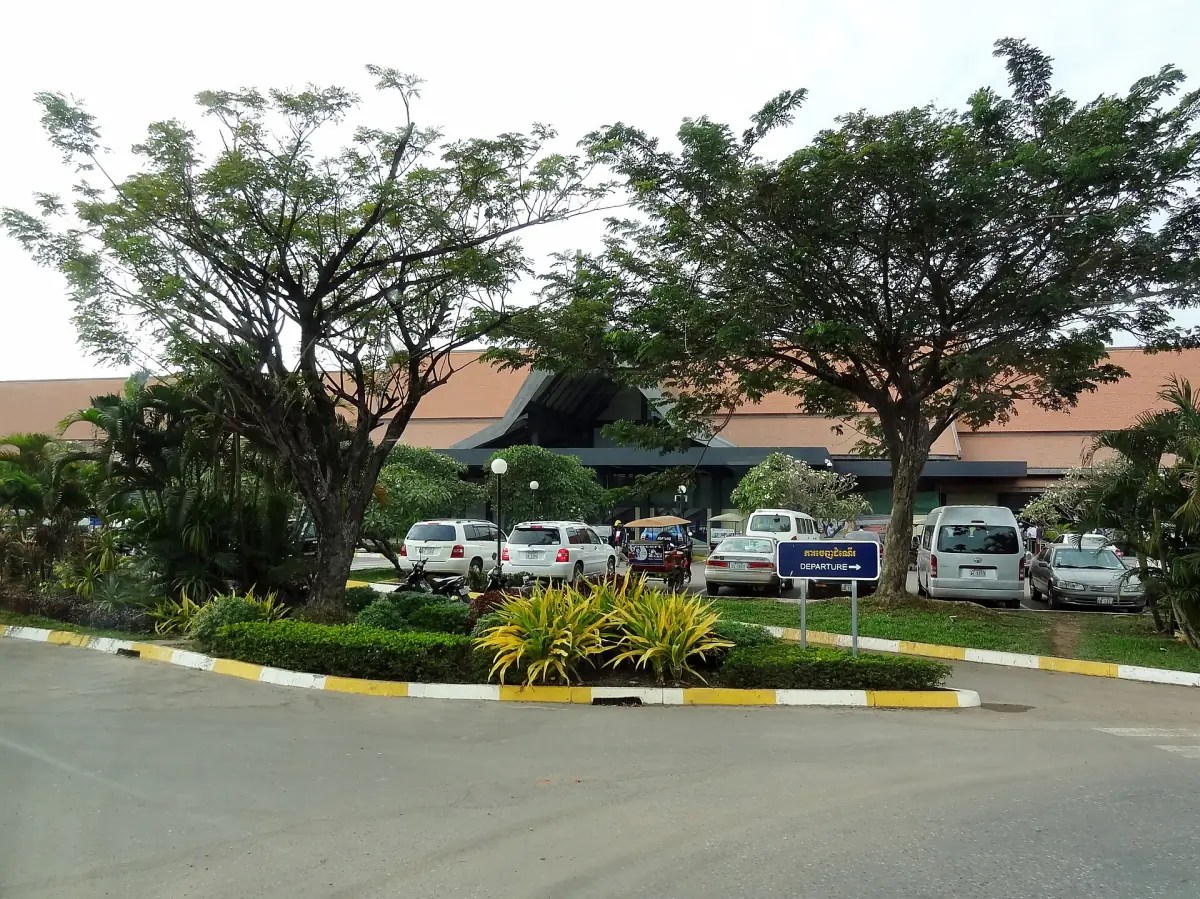 Entrance of Siem Reap airport among green trees
