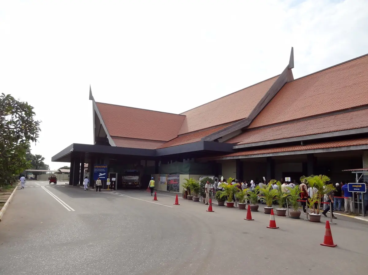 Siem Reap airport terminal with a low red roof