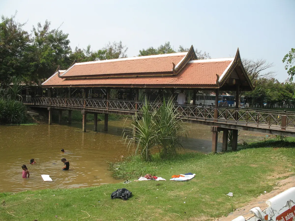 Covered wooden bridge over the river in Siem Reap