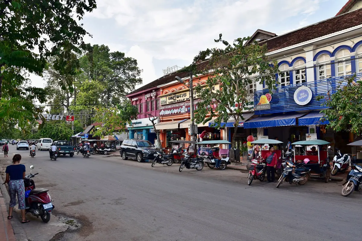 Row of tuk-tuks parked on a Siem Reap street