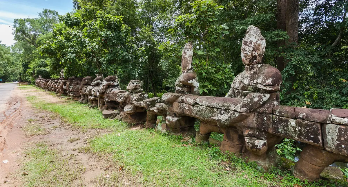Row of stone guardian figures along the causeway to the Victory Gate